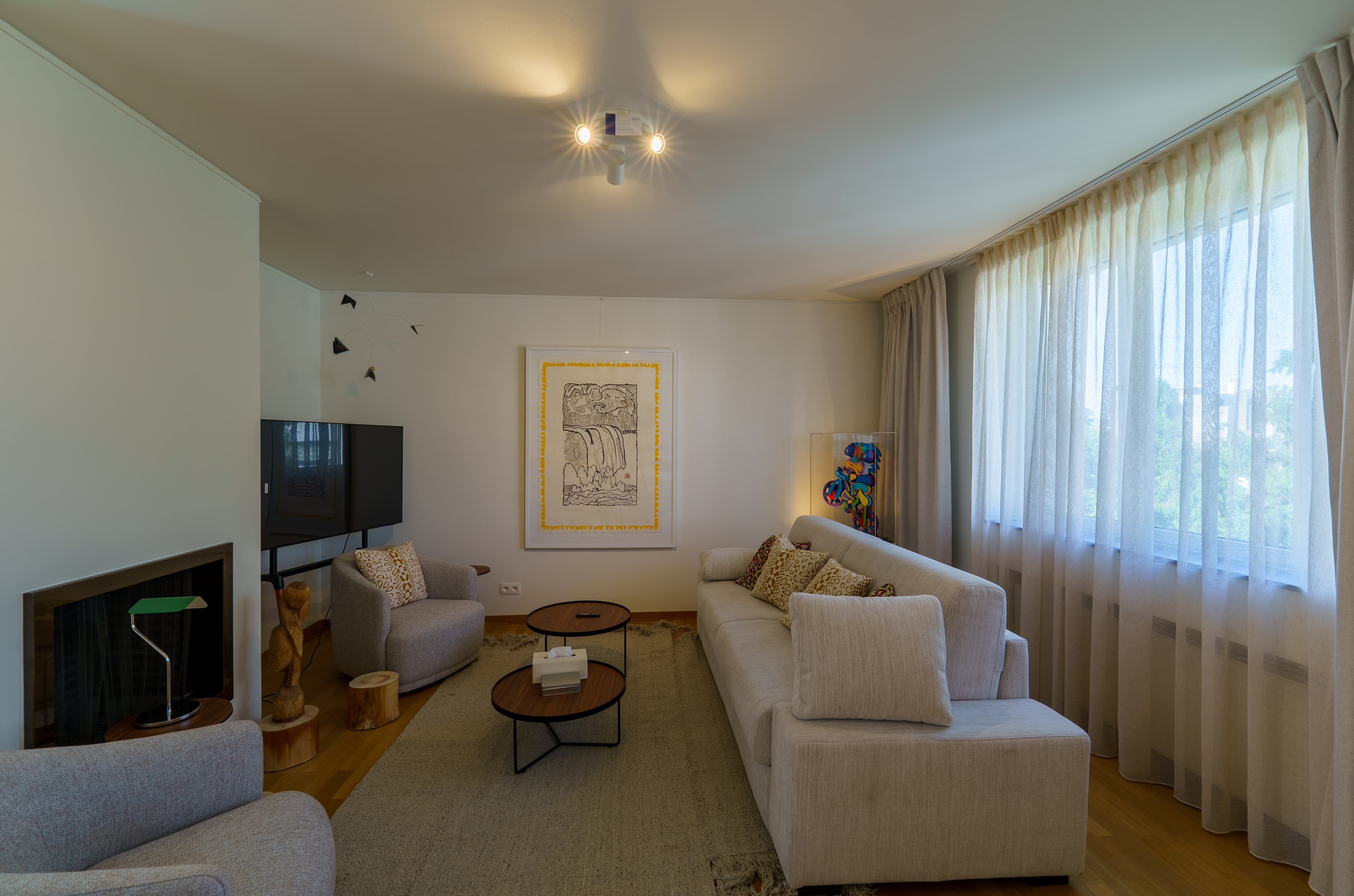Top-floor sitting room with a sofa, armchairs and a fireplace